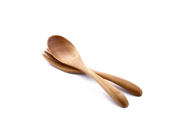 Close up wooden fork and spoon on white