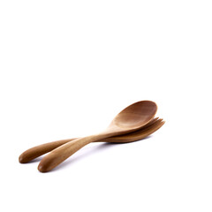Close up wooden fork and spoon on white