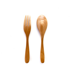 Close up wooden fork and spoon on white