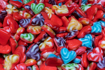 Multicolored colorful heart shaped marmalade. Texture background.