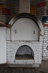 Fototapeta na wymiar old Russian brick oven with a flap for cooking
