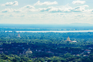 a city with a body of water in the distance