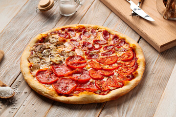 Assorted four seasons pizza on the wooden rustic table
