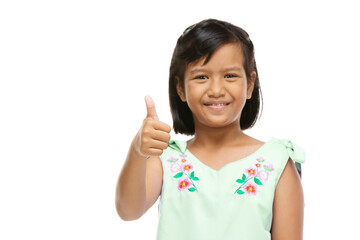 Asian cute girl presenting something on hand over white background