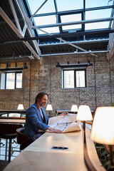 Successful businessman dealing with his paperwork at the table