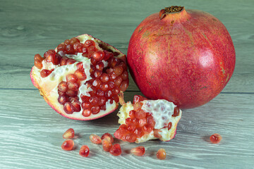 Juicy ripe pomegranates. Concept of vegan food.