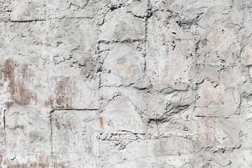 Old gray stone wall, frontal background texture