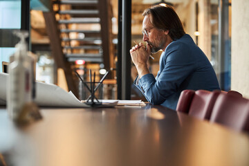 Creative thinker sitting in office and brainstorming