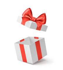 White open gift box with red ribbon and bow isolated on white. Clipping path included