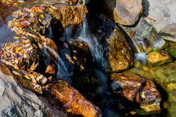 Closeup flowing water from small stream