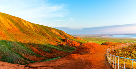 Big Bogdo mountain. Red sandstone outcrops on the slopes sacred mountain in Caspian steppe Bogdo -...