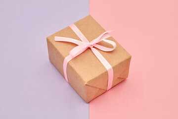 Christmas or New Year gift box on a colorful background. Close-up, selective focus