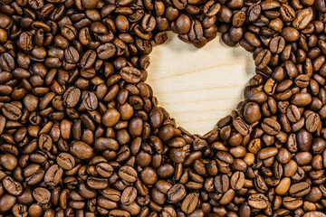 Roasted coffee beans with heart form