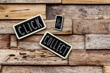 on wooden background, two small slates with the text 
