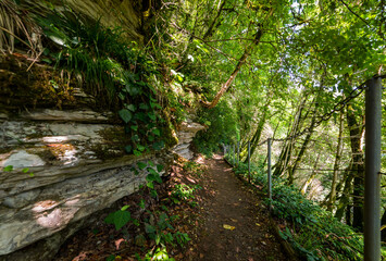 Textures of various stone layers at wall on hiking trail