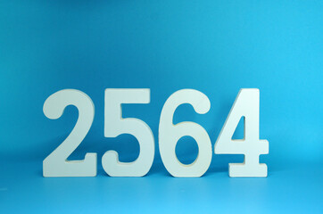 2564 number wooden object on Blue background and copy space - Happy new year 2564 , Chinese new year - Blue concept - Thai Year