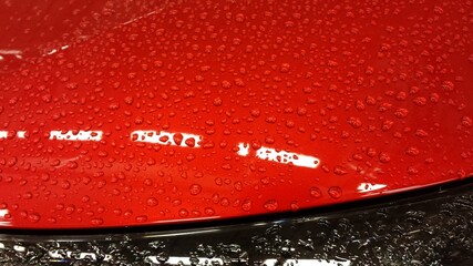 red car after rain
