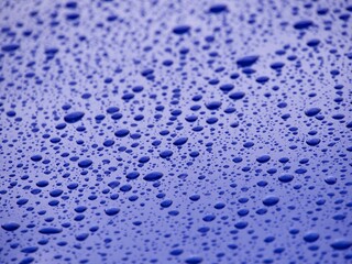 water drops on blue car background