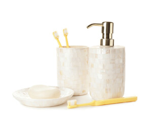Fototapeta na wymiar Composition of bath accessories and cup with toothbrushes on white background