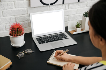 Girl studying at home. Concept of online education