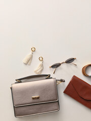 Fototapeta Stylish bag and accessories on light background obraz