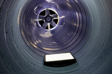 forgotten smartphone in the duct during installation of ventilation systems against a blurred...