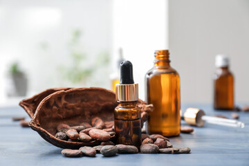 Bottles of coffee essential oil on table