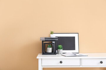 Stylish workplace near color wall