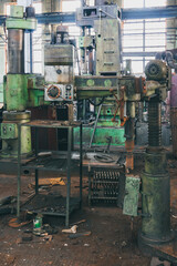 An abandoned old large industrial hall is waiting for demolition, an Industrial machine for metal processing, A former Khabarovsk plant for the production of a diesel engine.