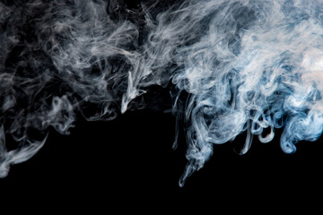 gray smoke with a blue tint on a black background