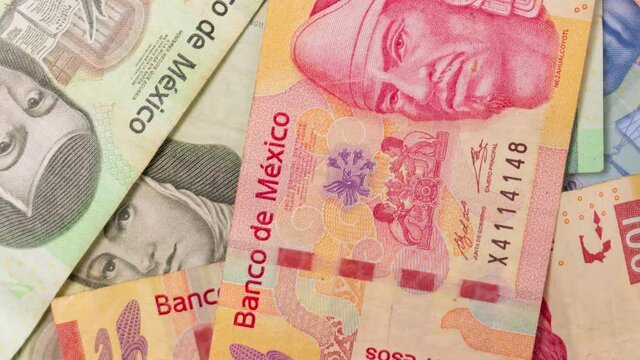Colorful stop motion collage animation of mexican pesos of different denominations