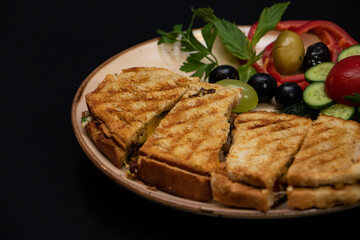 Toasted cheese and ham sandwich, breakfast plate