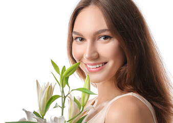 Fototapeta premium Beautiful young woman with fresh lilies on white background