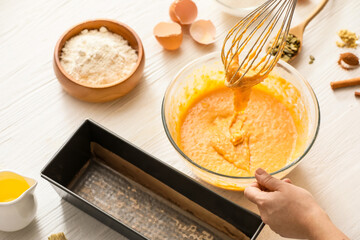 Preparing of pumpkin pie on table