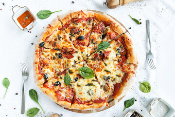 freshly baked pizza on a white tablecloth
