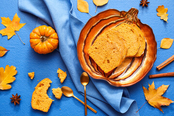 Plate with tasty pumpkin pie on color background