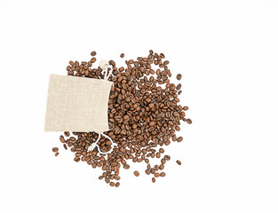 Top view of coffee beans in jute bag on white background stock photo. Group of coffee beans in jute bag isolated on white background