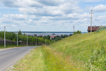 Fototapeta na wymiar Kozmodemyansk, view of the Smolensk Cathedral and the wide Volga river, photo was taken on a sunny summer day