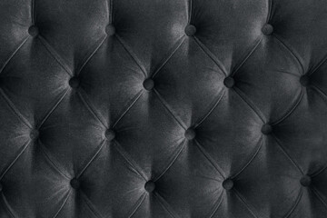 Quilted velour buttoned ultimate grey color fabric wall pattern background. Elegant vintage luxury...