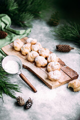 Profiteroles with custard on the table. New Year's dessert