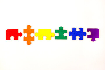 LGBT concept. Rainbow colored puzzle isolated on white background. Gay Pride. Concept of equality,...