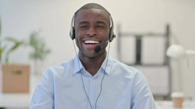 Portrait of Smiling African Man Wearing Headset, Call Center