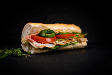 Delicious fresh sandwich with chicken, cheese and vegetables.