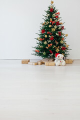 New year decorated Christmas tree with gifts in the room