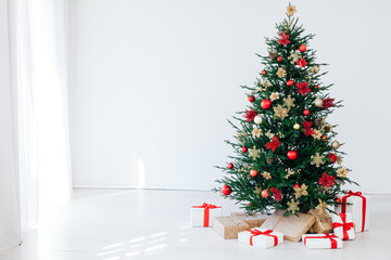New year decorated Christmas tree with gifts in the house