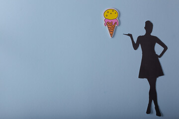 silhouette of a girl with ice cream on a blue background