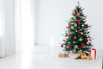 New year decorated Christmas tree with gifts in the house