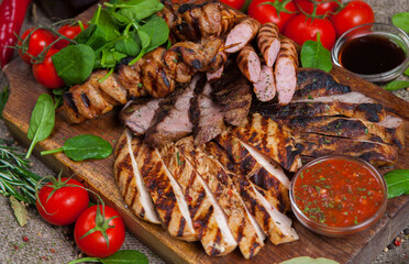 Mixed grilled meat platter. Assorted delicious grilled meat with vegetable. Mixed grilled meat with...