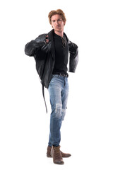 Naklejka premium Cool confident young man getting dressed put on black leather jacket looking at camera. Full body length isolated on white background. 