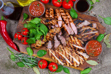 Mixed grilled meat platter. Assorted delicious grilled meat with vegetable. Mixed grilled meat with...